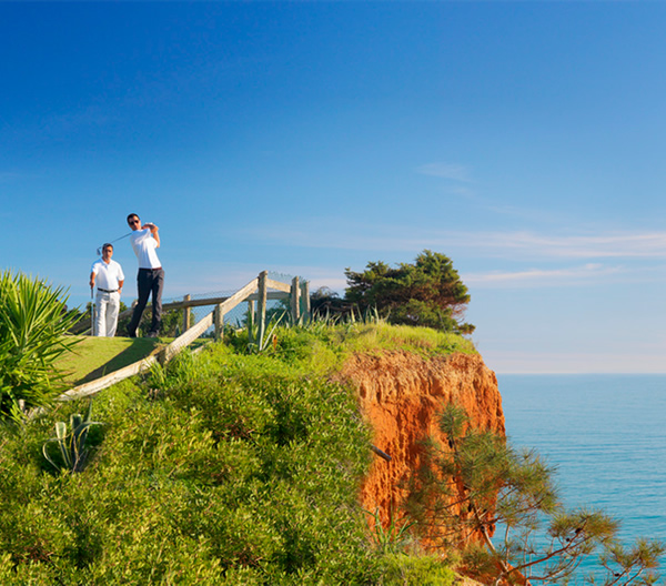 Golfers on a clifftop course