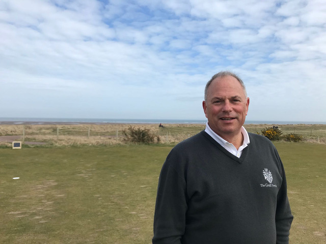 Golfer on a links course by the sea